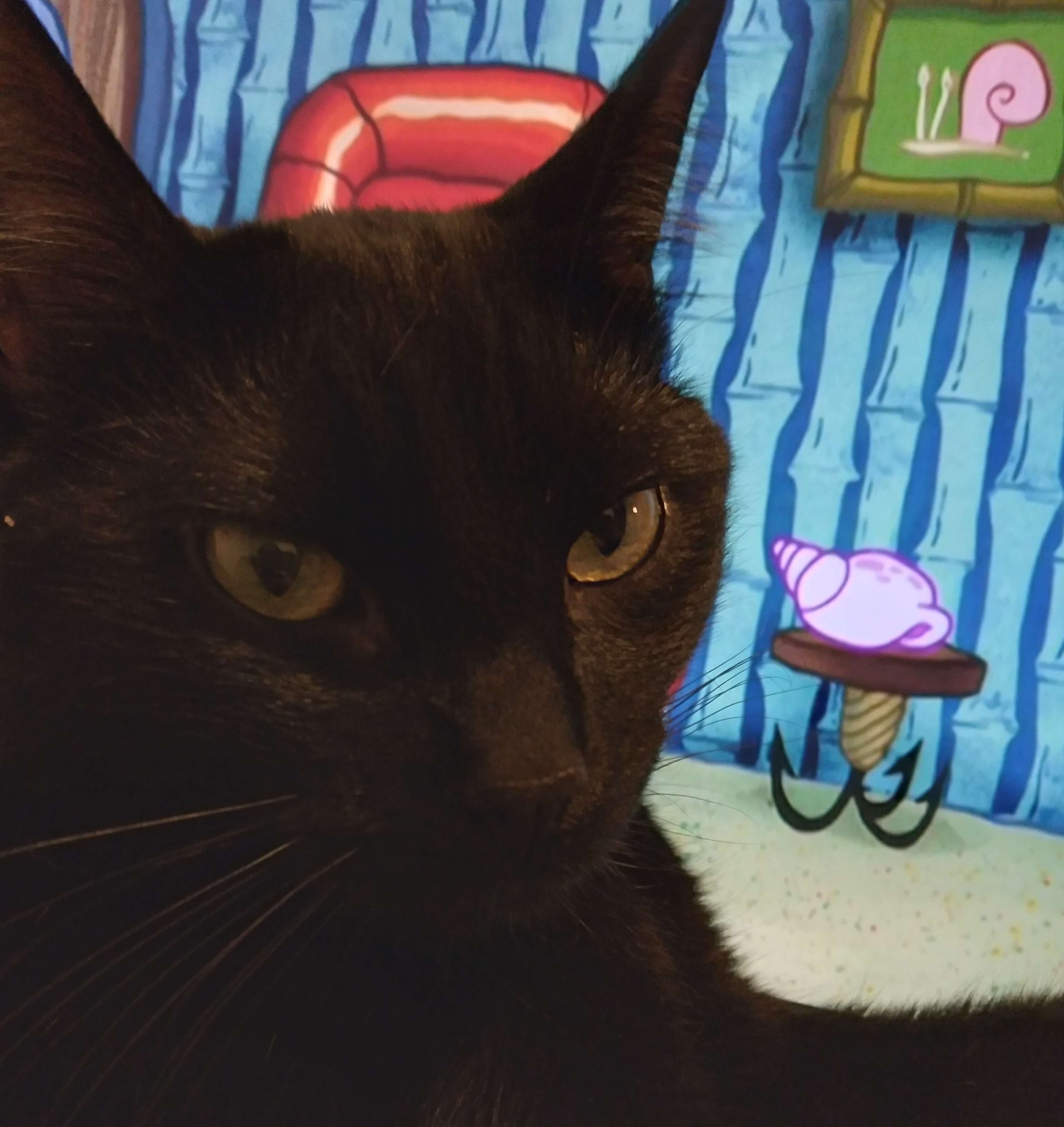 otis sitting in front of a spongebob background